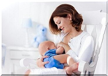 Mother breastfeeds baby