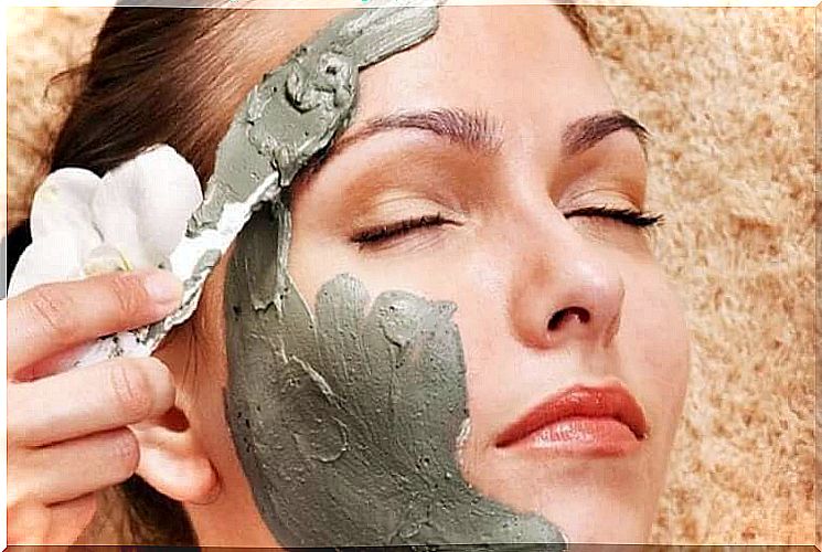 Woman wearing clay facial mask