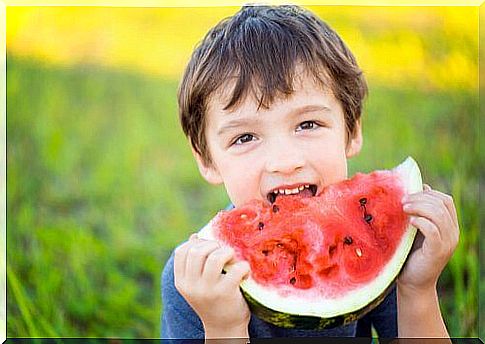 Child eats melon