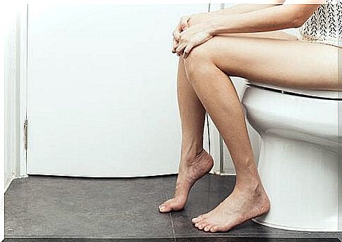 Woman with worms in her intestines on the toilet