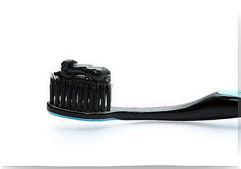 Black toothbrush with black toothpaste